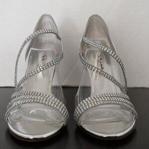 Dressy Nina shoe; Silver metallic with rhinestone detail. Women's size 9 (US).